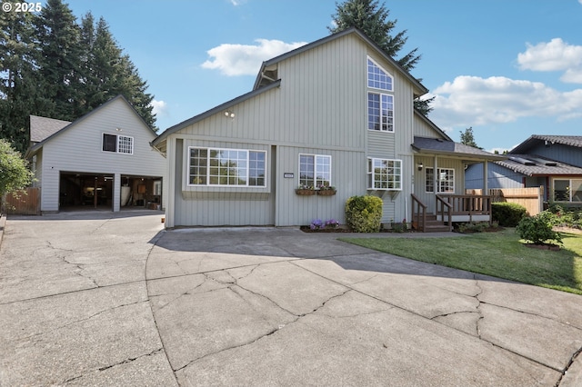 243 N 30th Ct, Cornelius, OR 97113 - back of house with an outdoor structure, a garage, driveway, and a yard
