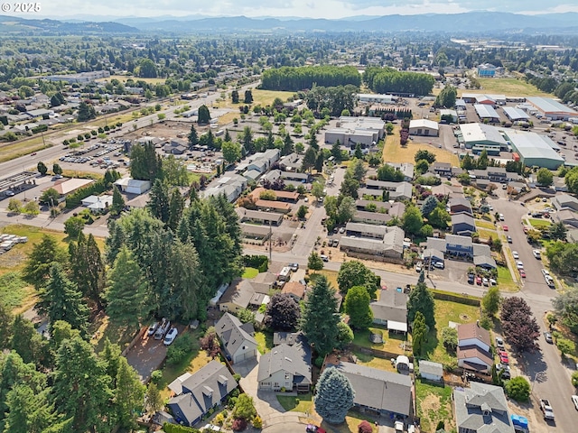 243 N 30th Ct, Cornelius, OR 97113 - aerial overview of property's location with a mountain backdrop and nearby suburban area
