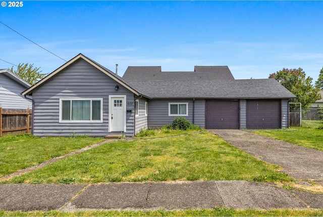 single story home with an attached garage, a shingled roof, a front lawn, and fence