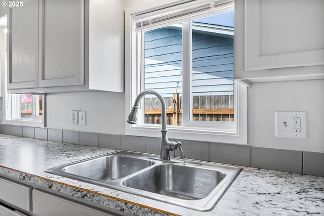 room details featuring a sink and light countertops