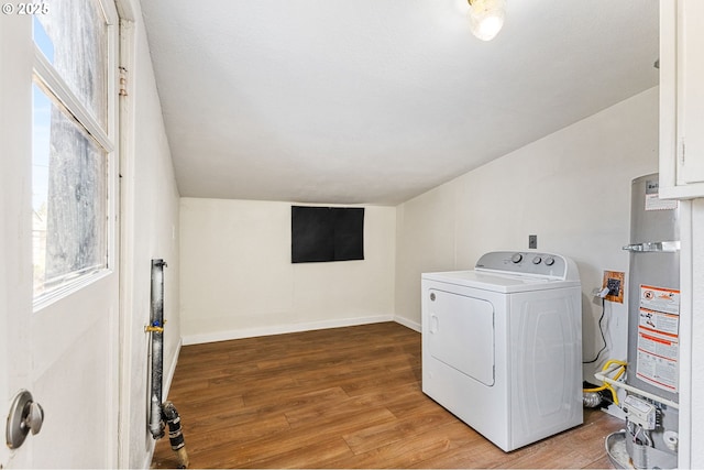 laundry room with washer / clothes dryer, laundry area, light wood-style flooring, and water heater