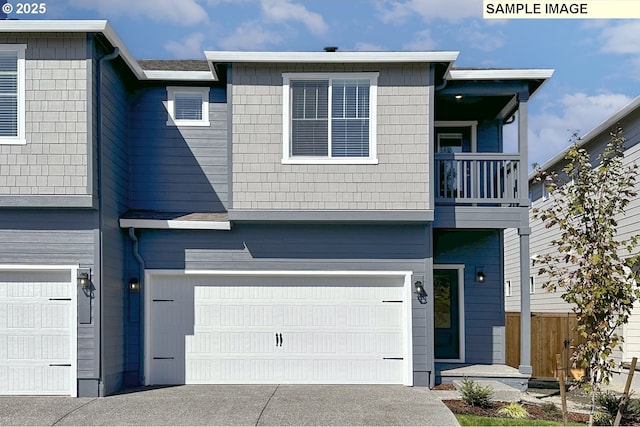 multi unit property featuring a garage and a balcony