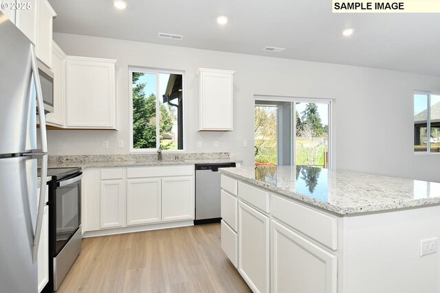 5318 NE 68th St, Vancouver, WA 98661 - kitchen featuring a center island, visible vents, recessed lighting, and appliances with stainless steel finishes