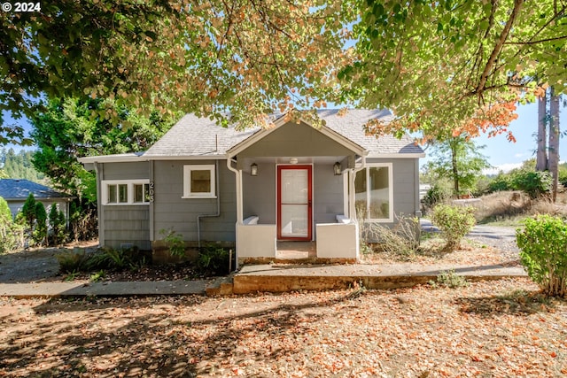 bungalow featuring a shingled roof