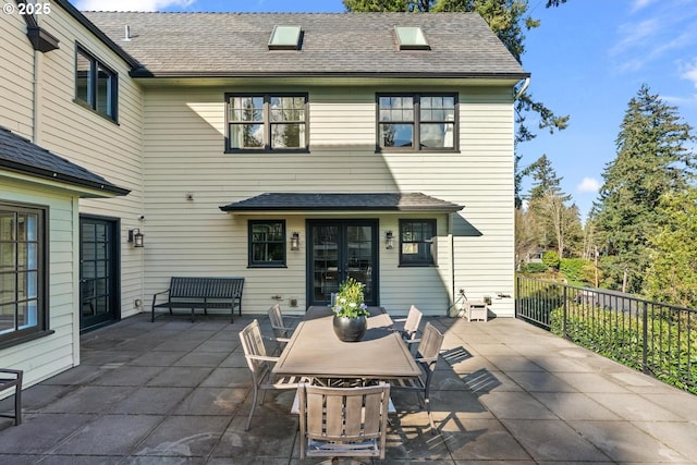 view of patio / terrace with french doors and fence