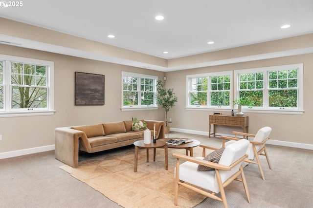 living area featuring recessed lighting, light colored carpet, visible vents, and baseboards