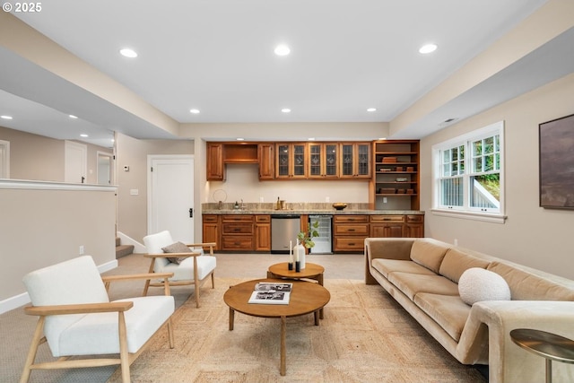 living room featuring light carpet, beverage cooler, recessed lighting, wet bar, and baseboards