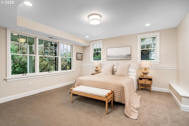 carpeted bedroom featuring recessed lighting, visible vents, and baseboards