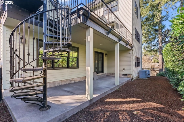 exterior space with central air condition unit and a patio