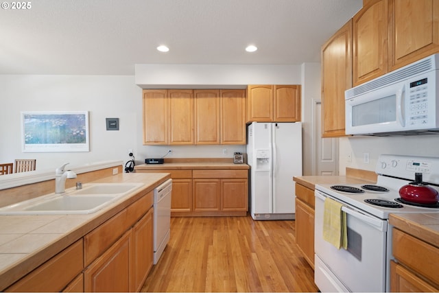 17146 SE 23rd Dr Unit 20, Vancouver, WA 98683 - kitchen with white appliances, a sink, tile counters, light wood-style flooring, and recessed lighting