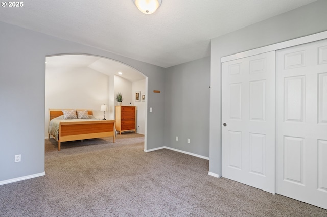 17146 SE 23rd Dr Unit 20, Vancouver, WA 98683 - bedroom with arched walkways, carpet floors, baseboards, and a closet