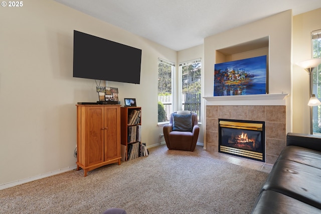 17146 SE 23rd Dr Unit 20, Vancouver, WA 98683 - living room featuring a tile fireplace, healthy amount of natural light, carpet flooring, and baseboards