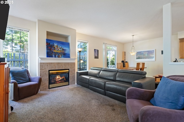 17146 SE 23rd Dr Unit 20, Vancouver, WA 98683 - living room with plenty of natural light, a tile fireplace, and carpet floors