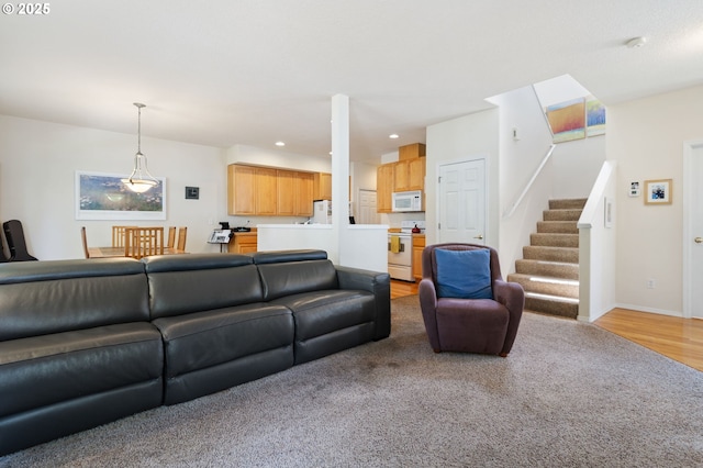 17146 SE 23rd Dr Unit 20, Vancouver, WA 98683 - living area with stairs, recessed lighting, baseboards, light colored carpet, and light wood finished floors