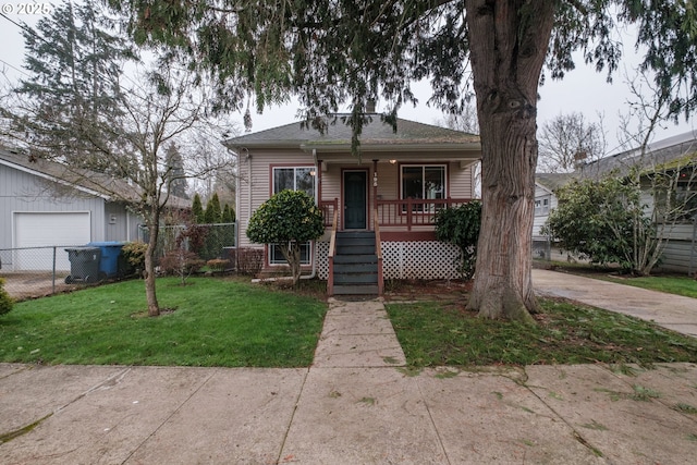 view of front of home featuring covered porch and a front yard