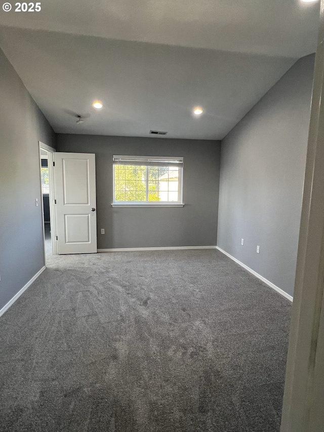 spare room featuring carpet floors