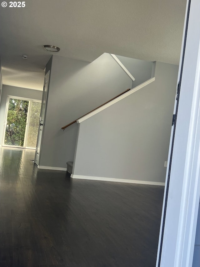 stairs with hardwood / wood-style floors