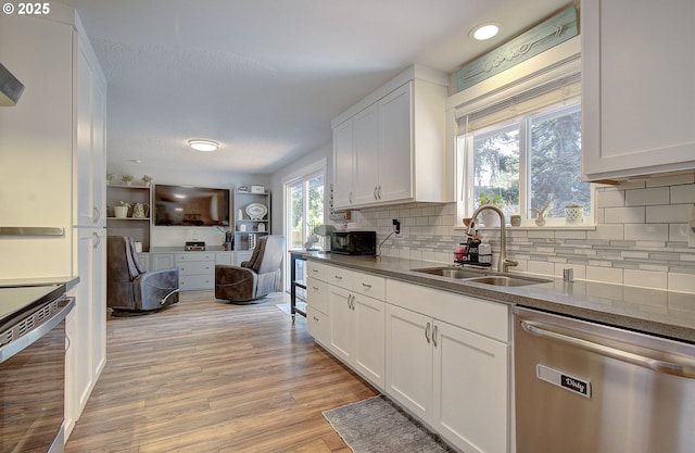 11204 NE 85th Cir, Vancouver, WA 98662 - kitchen with dishwasher, range, white cabinets, backsplash, and recessed lighting