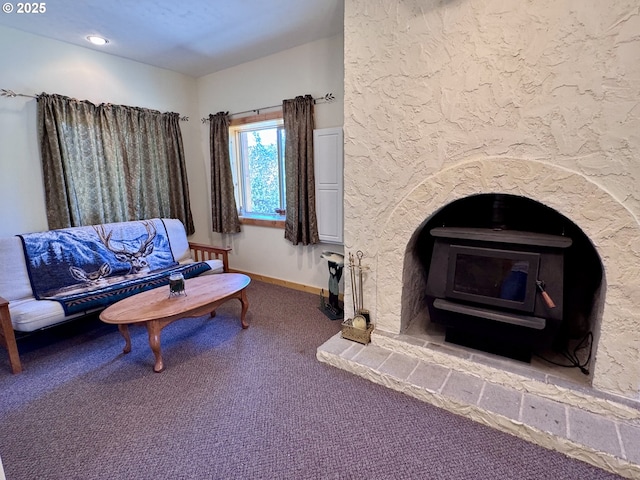 44552 Red Boy Rd, Granite, OR 97877 - carpeted living area featuring a wood stove and baseboards