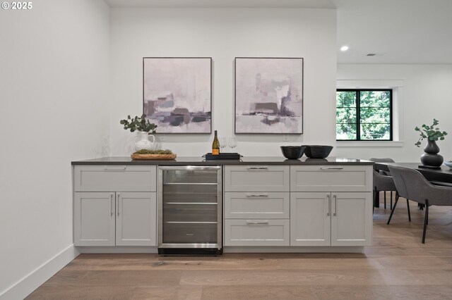 3884 Lake Grove Ave, Lake Oswego, OR 97035 - indoor dry bar with wine cooler, light wood-type flooring, and recessed lighting