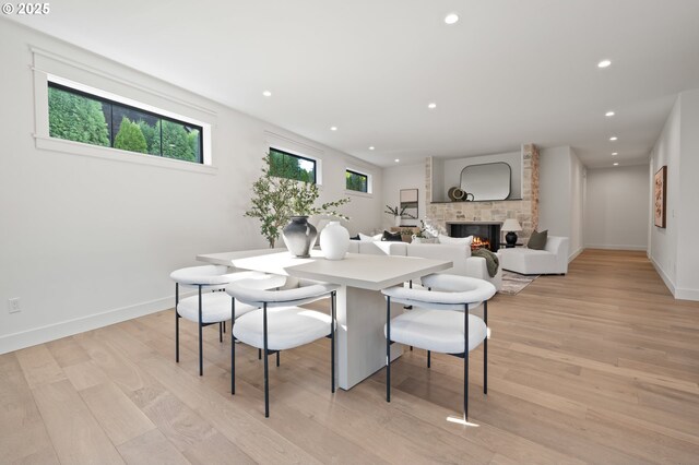 3884 Lake Grove Ave, Lake Oswego, OR 97035 - dining space with recessed lighting, light wood finished floors, baseboards, and a stone fireplace