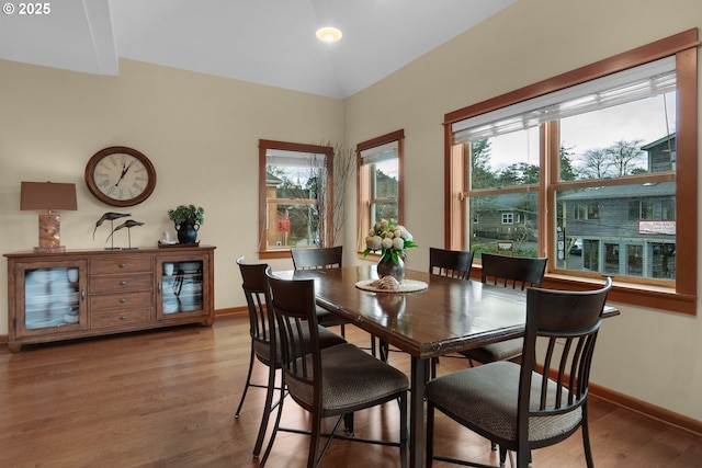 123 S Hemlock St # 201, Cannon Beach, OR 97110 - dining area with light wood-style flooring and lofted ceiling