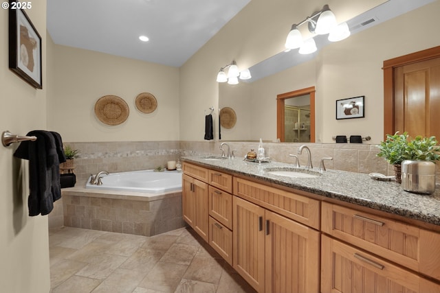 123 S Hemlock St # 201, Cannon Beach, OR 97110 - bathroom featuring double vanity, a bath, and an enclosed shower