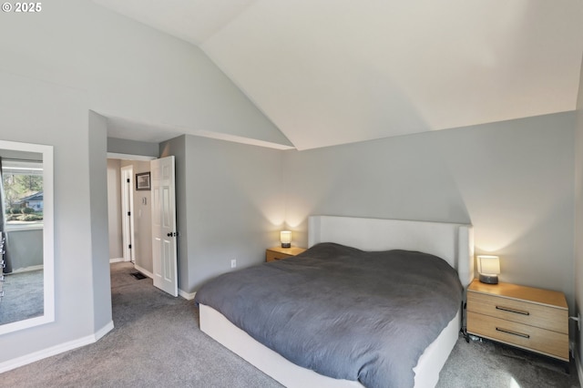 bedroom with baseboards, lofted ceiling, and carpet