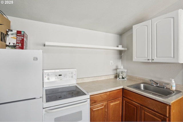 kitchen featuring open shelves, a sink, white cabinetry, white appliances, and light countertops