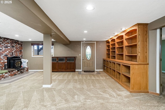41266 Manitau Rd SE, Stayton, OR 97383 - entryway featuring carpet floors, recessed lighting, and a wood stove
