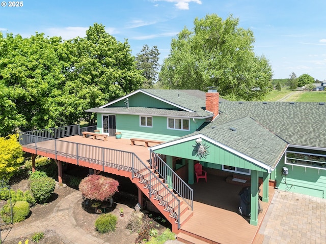 41266 Manitau Rd SE, Stayton, OR 97383 - rear view of house with a deck, a chimney, roof with shingles, and stairs