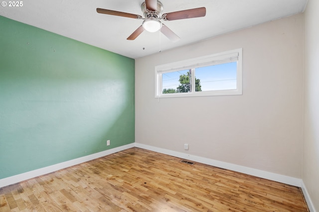 2222 34th Ave, Albany, OR 97322 - unfurnished room featuring wood finished floors, baseboards, and a ceiling fan