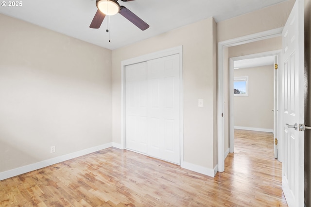 2222 34th Ave, Albany, OR 97322 - unfurnished bedroom with light wood finished floors, baseboards, a closet, and ceiling fan