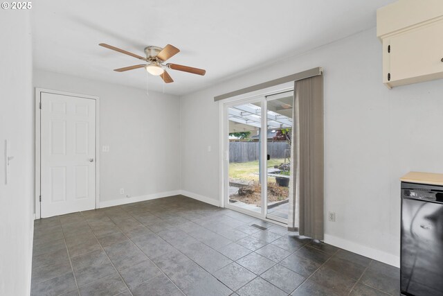 2222 34th Ave, Albany, OR 97322 - unfurnished dining area with a ceiling fan, baseboards, and dark stone finish floors