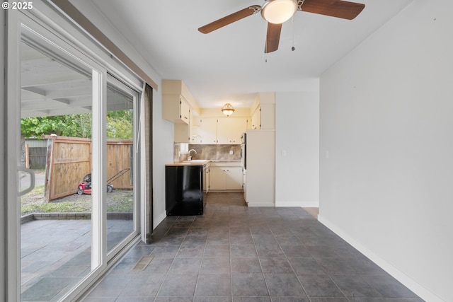 2222 34th Ave, Albany, OR 97322 - unfurnished living room with a sink, ceiling fan, and baseboards