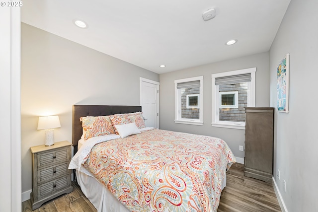 bedroom featuring recessed lighting, baseboards, and wood finished floors