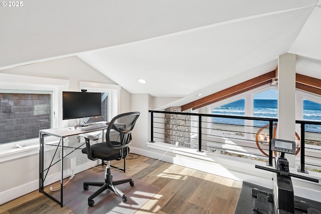 office with baseboards, vaulted ceiling, and wood finished floors