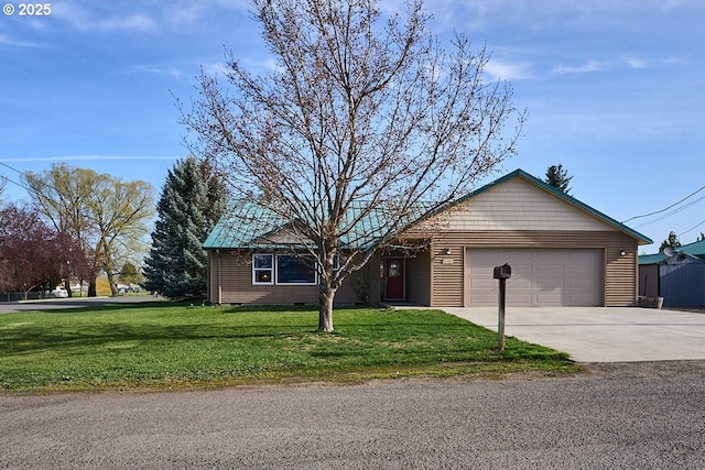 ranch-style home with a garage, driveway, and a front yard
