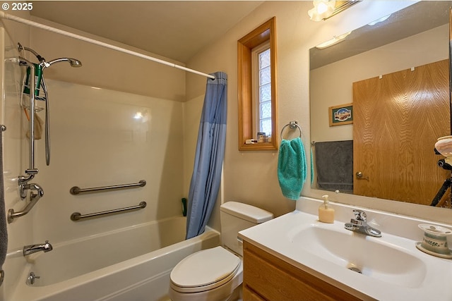 bathroom with shower / bath combo with shower curtain, toilet, and vanity
