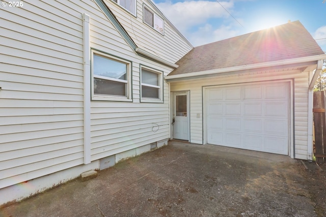 garage with asphalt driveway