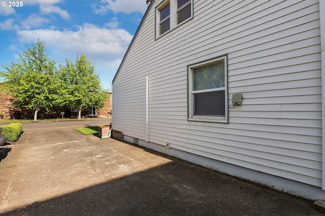 view of side of home featuring a patio
