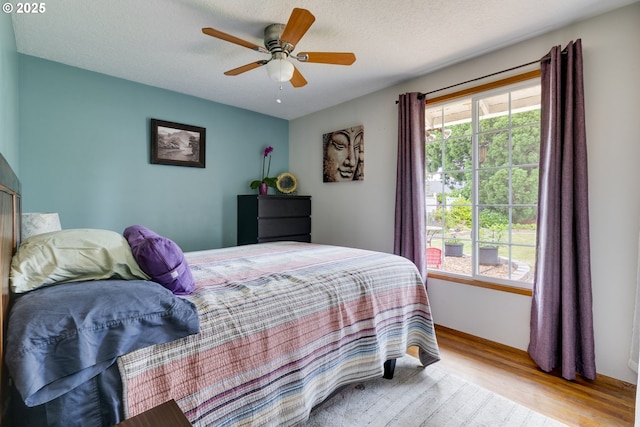 3441 SE 162nd Ave, Portland, OR 97236 - bedroom featuring wood finished floors and a ceiling fan