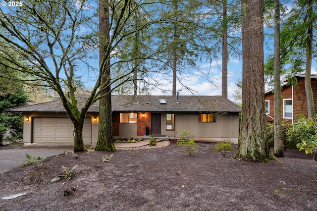 view of front of house featuring driveway and a garage