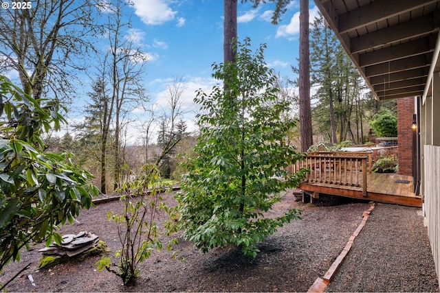 view of yard with a wooden deck