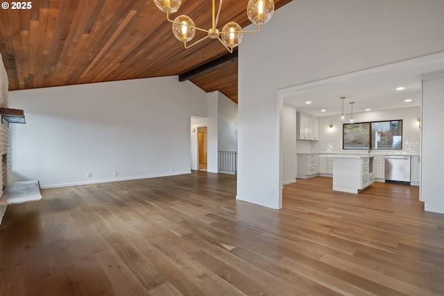 136 Del Prado St, Lake Oswego, OR 97035 - unfurnished living room featuring a chandelier, light wood-style flooring, recessed lighting, wooden ceiling, and a stone fireplace