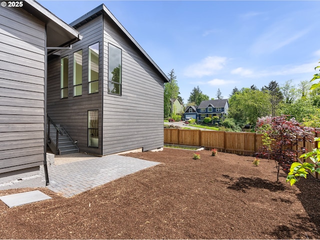 view of yard featuring a fenced backyard and a patio area
