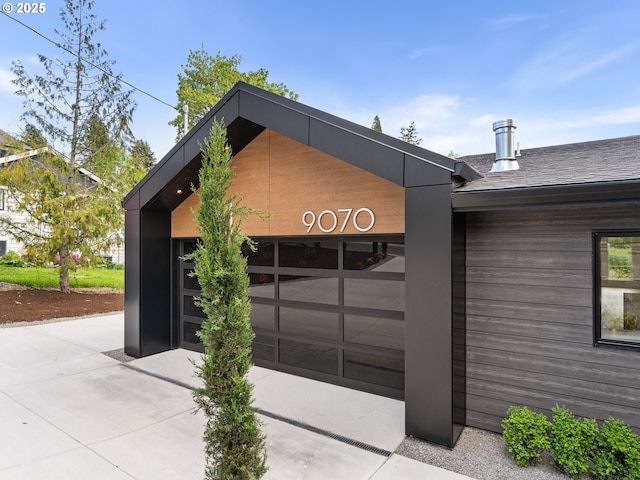 garage with concrete driveway