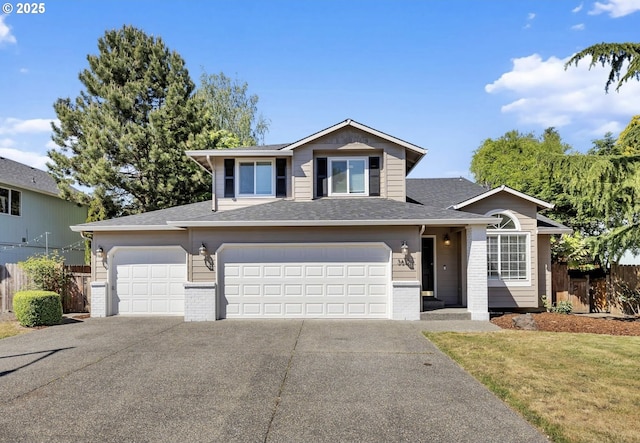 3612 NE 111th St, Vancouver, WA 98686 - view of front of house featuring fence, concrete driveway, brick siding, roof with shingles, and an attached garage