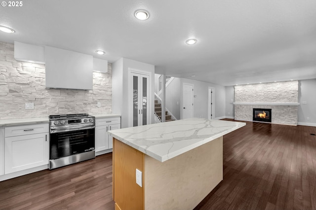 3612 NE 111th St, Vancouver, WA 98686 - kitchen with stainless steel range with gas stovetop, a kitchen island, dark wood-style flooring, and open floor plan