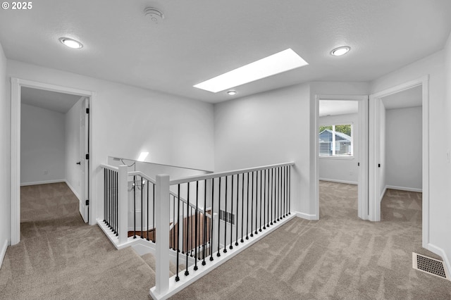 3612 NE 111th St, Vancouver, WA 98686 - corridor with carpet flooring, a skylight, baseboards, an upstairs landing, and recessed lighting